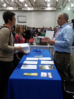 Greg Brussler, NASS State Statistician for Minnesota, staffing a booth at the International Cheese Technology Exposition in Madison, Wisconsin, last April.